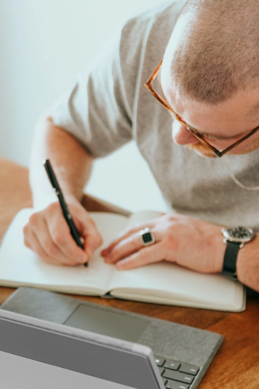 Man writing in notebook