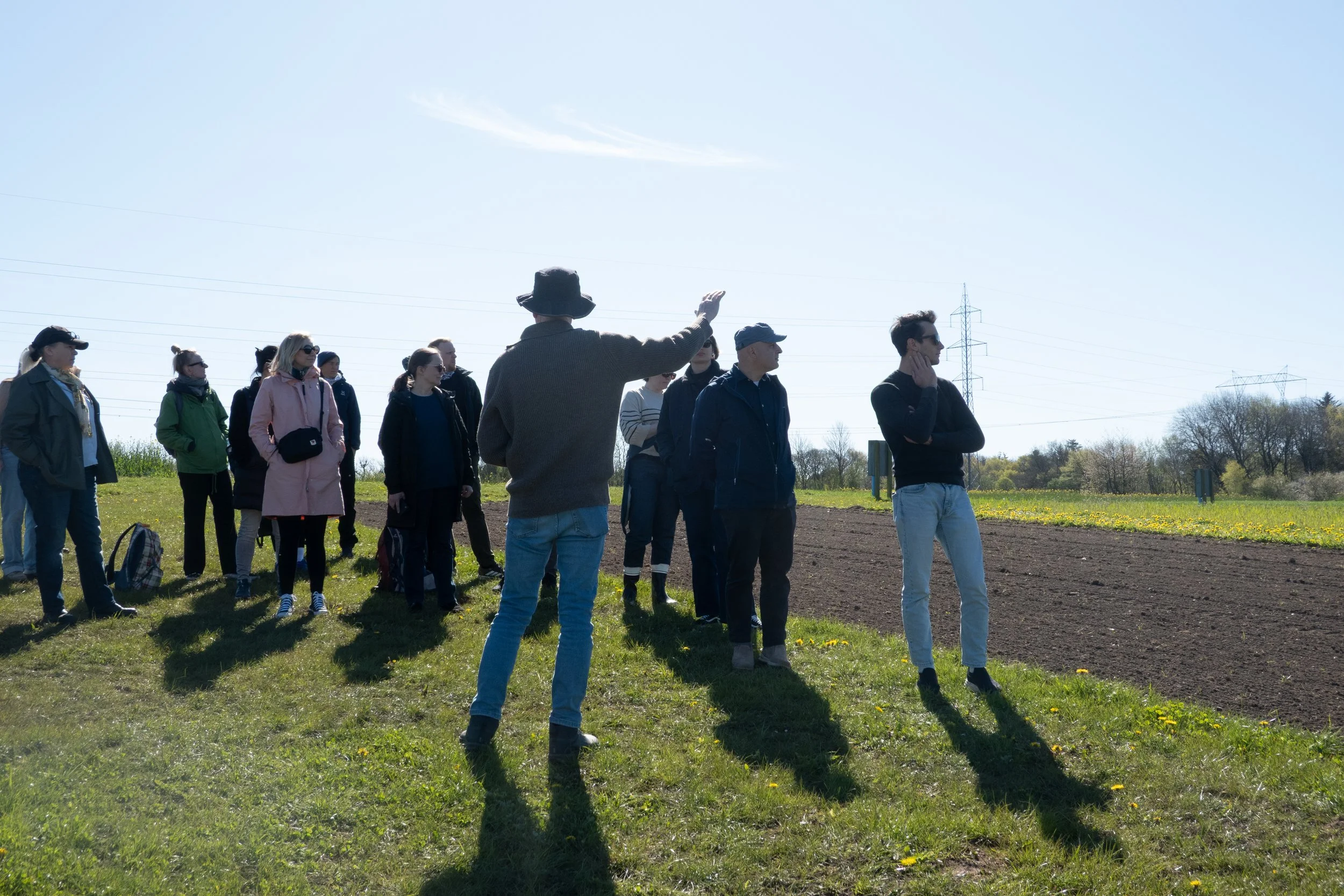 Group of people on a farm on a sunny day 