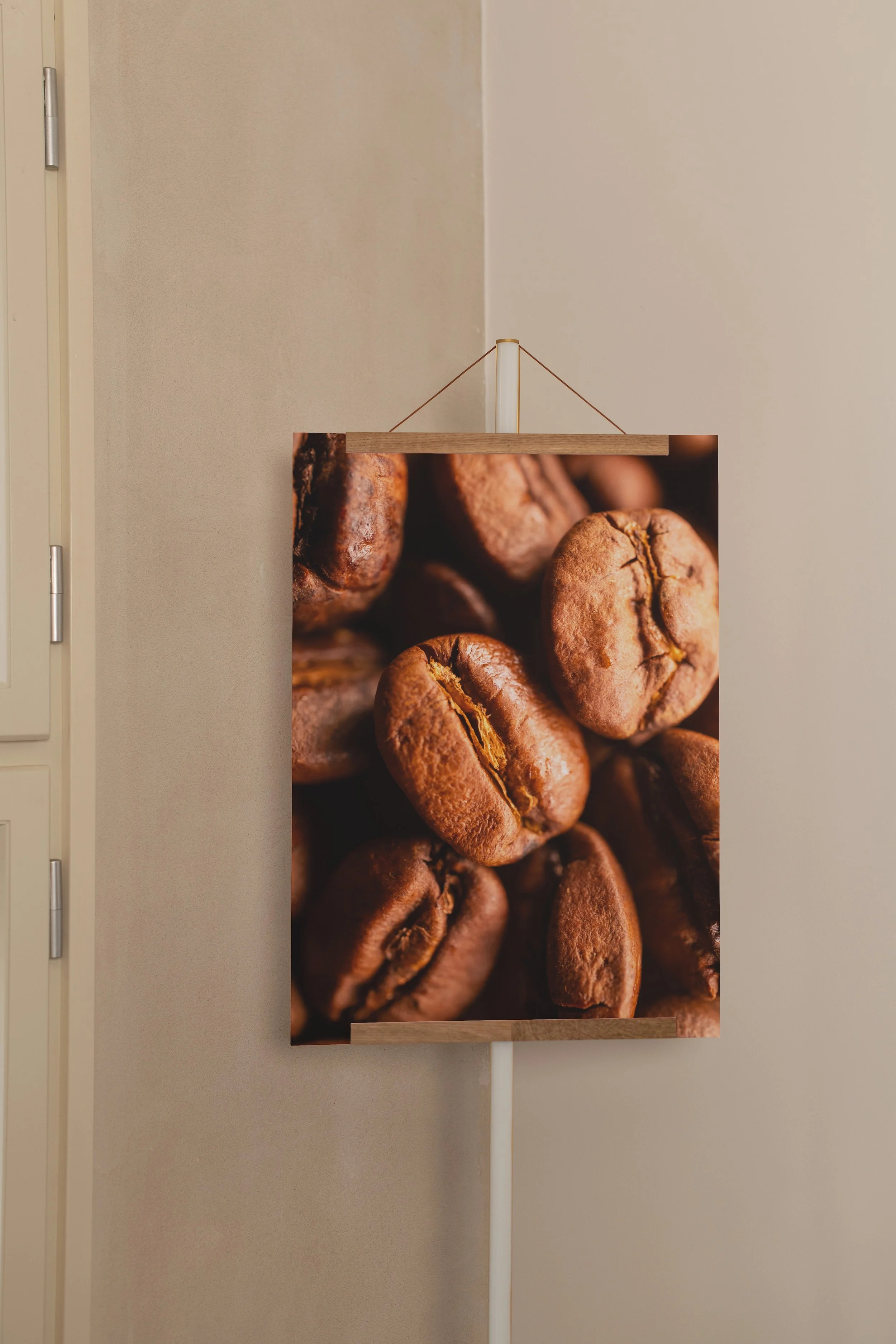 Mockuuups A3 poster mockup with wooden hanger in a neutral interior.jpeg