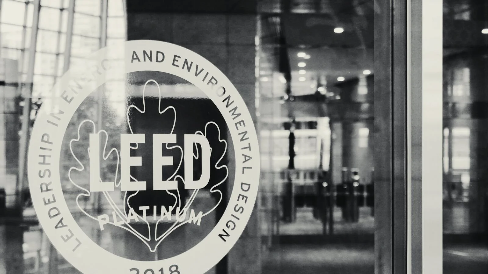 A hiker waking down a rocky mountaintop.