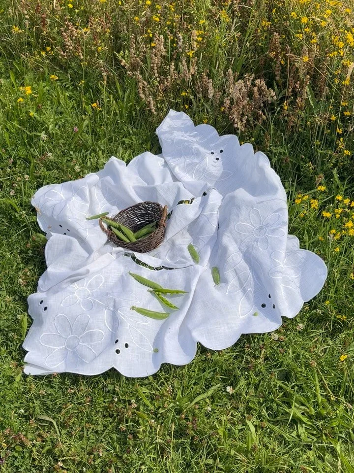 Long days, garden greens, and a table set with no rush. This is what summer looks like when you slow down enough to see it. 

Featuring our handcrafted cutwork tablecloth.