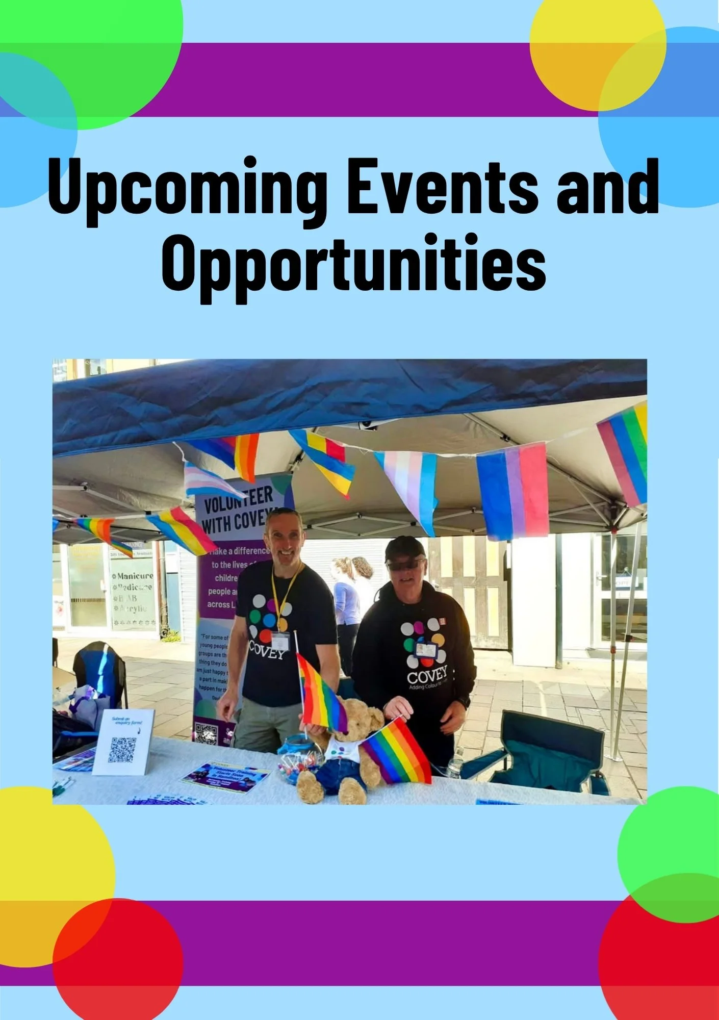 Two people standing at a booth with rainbow flags and informational materials, promoting LGBTQ+ and inclusive community events.