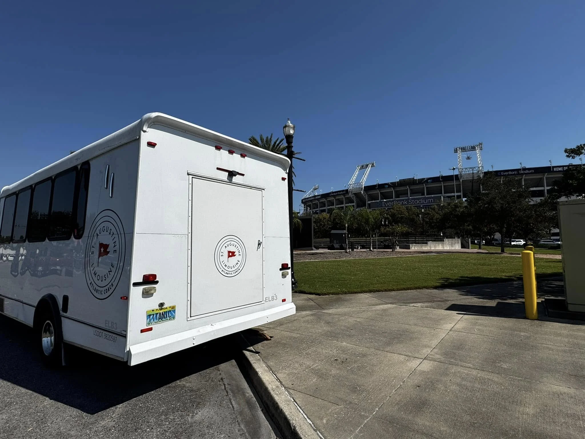 White trailer parked near EverBank Stadium with a clear blue sky overhead.