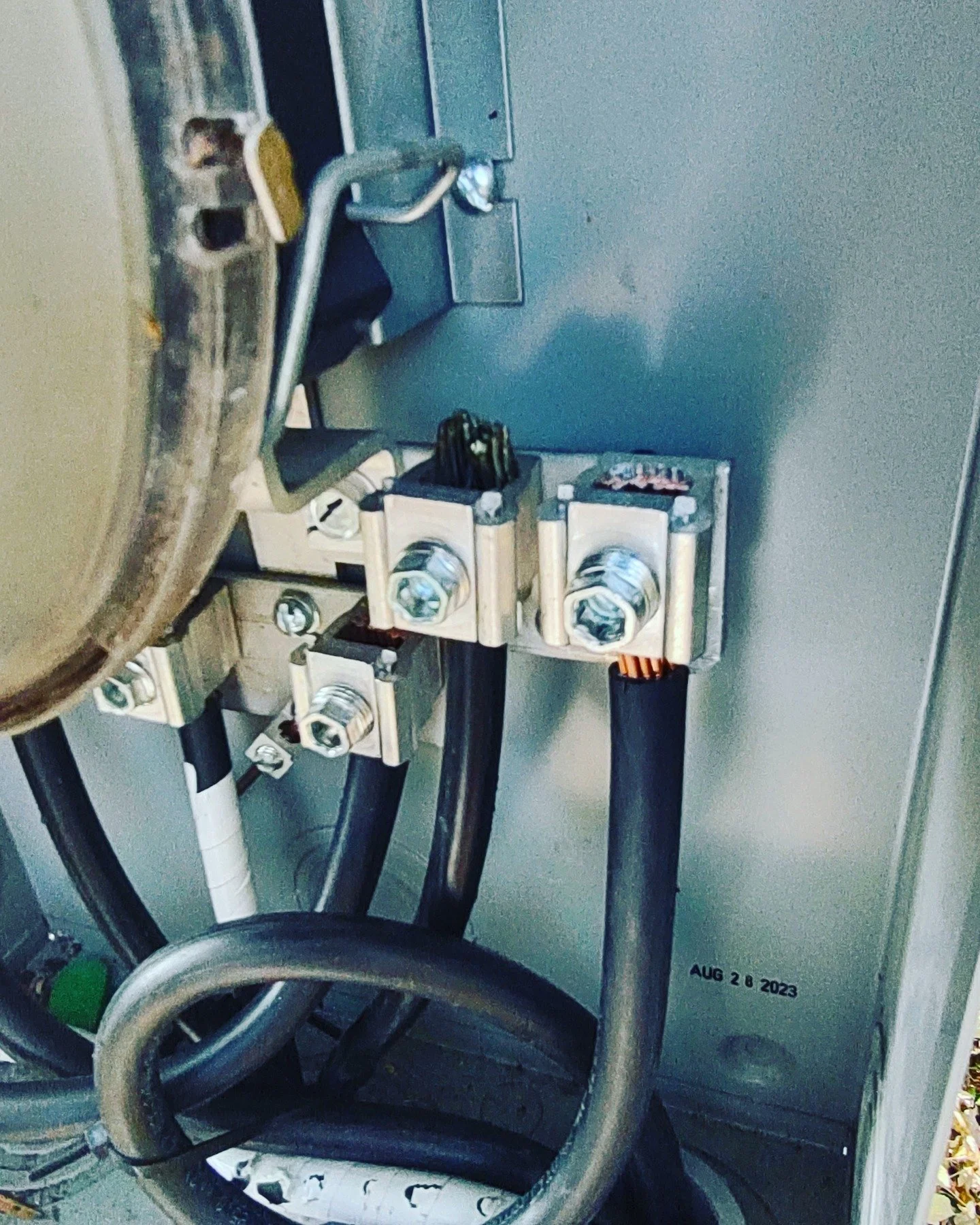 This picture shows the terminations for two sets of service conductors which serve two separate buildings. Service conductors are distinct from feeder conductors in several ways, including where they originate, how they are sized, and how they handle