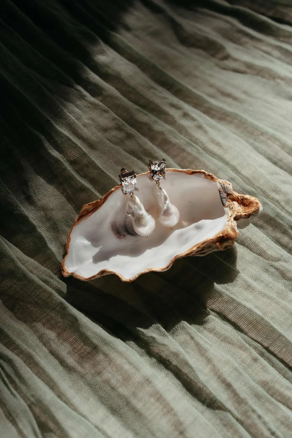 Oyster shell holding the bride's earring
