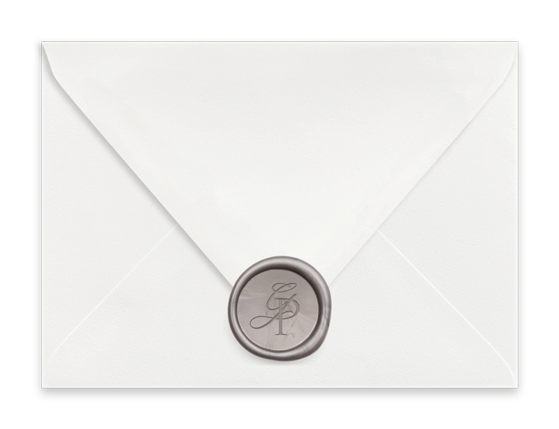 White envelope sealed with a wax seal featuring initials.