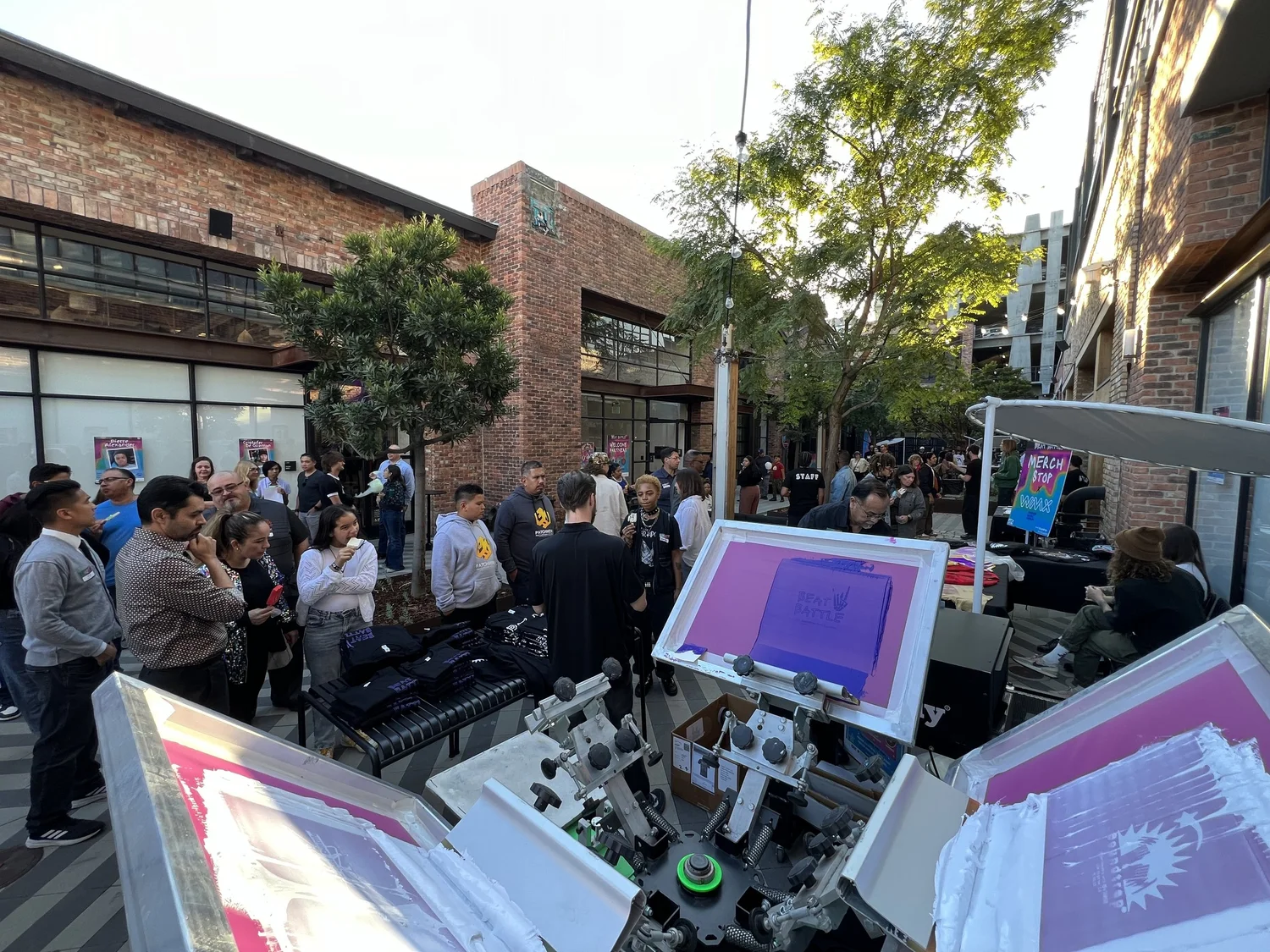 Merch Troop crew printing apparel live for event guests.