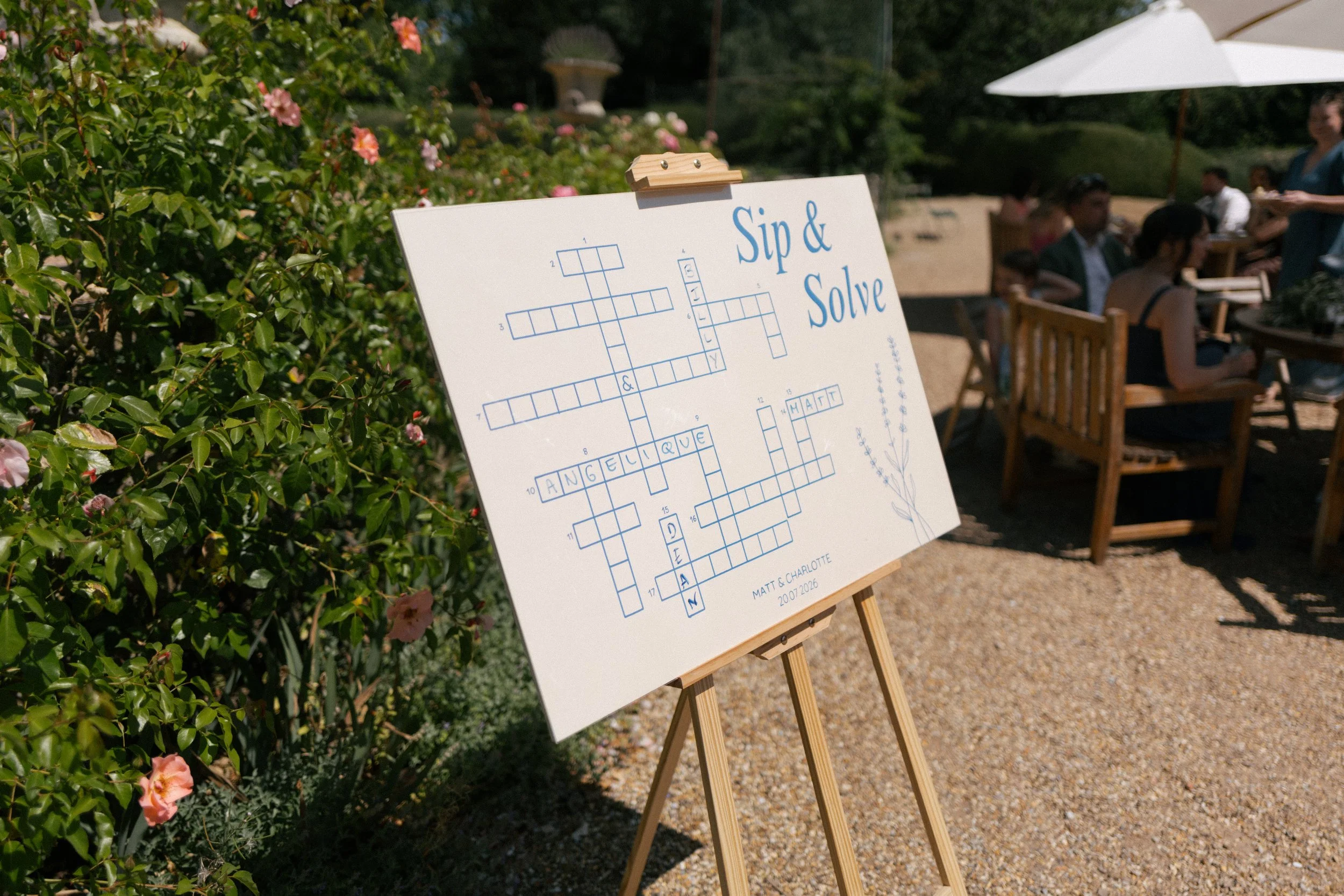 An interactive sip n solve sign for the drinks reception at a summer wedding