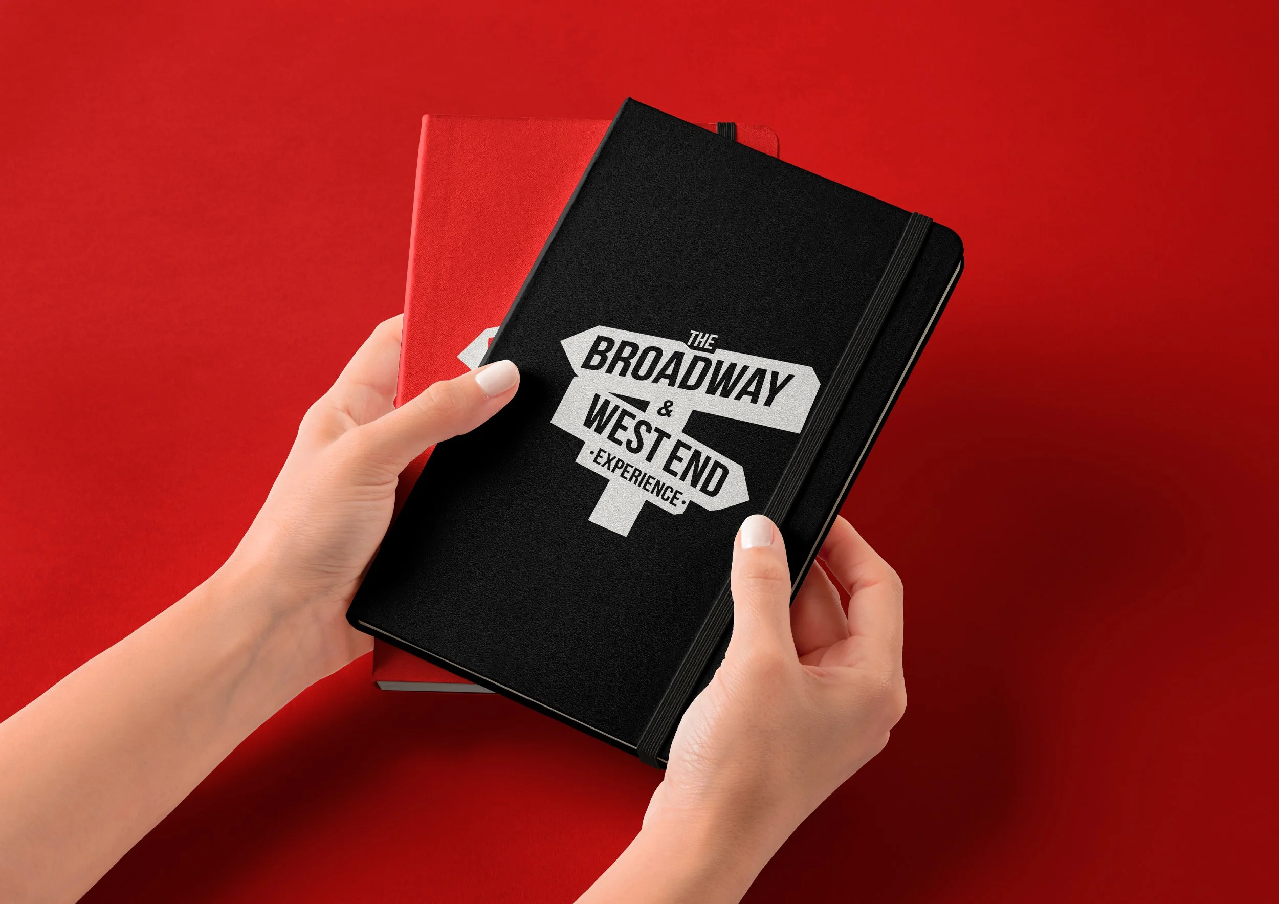Image of two notebooks with Broadway & West End Experience Branding on them