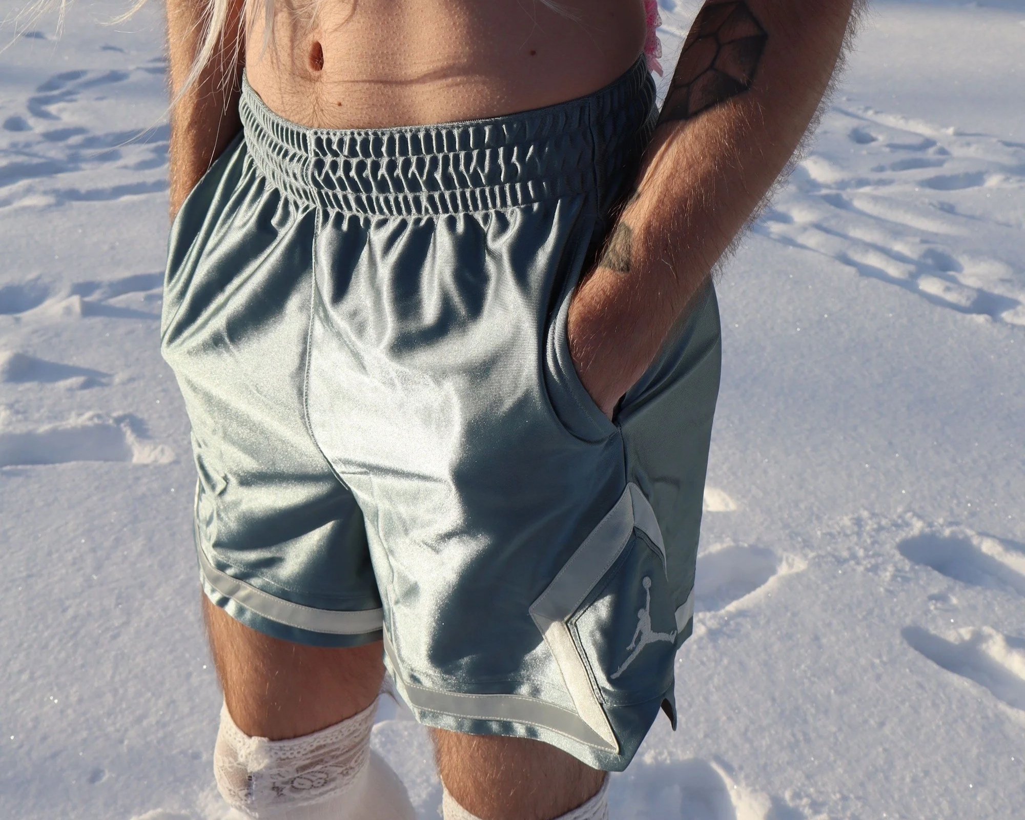 Ave Vanilla - Frozen Vanilla: A tactile close-up focusing on skin texture, satin shorts, and white stockings against the crisp white snow [cite: 26, 46]