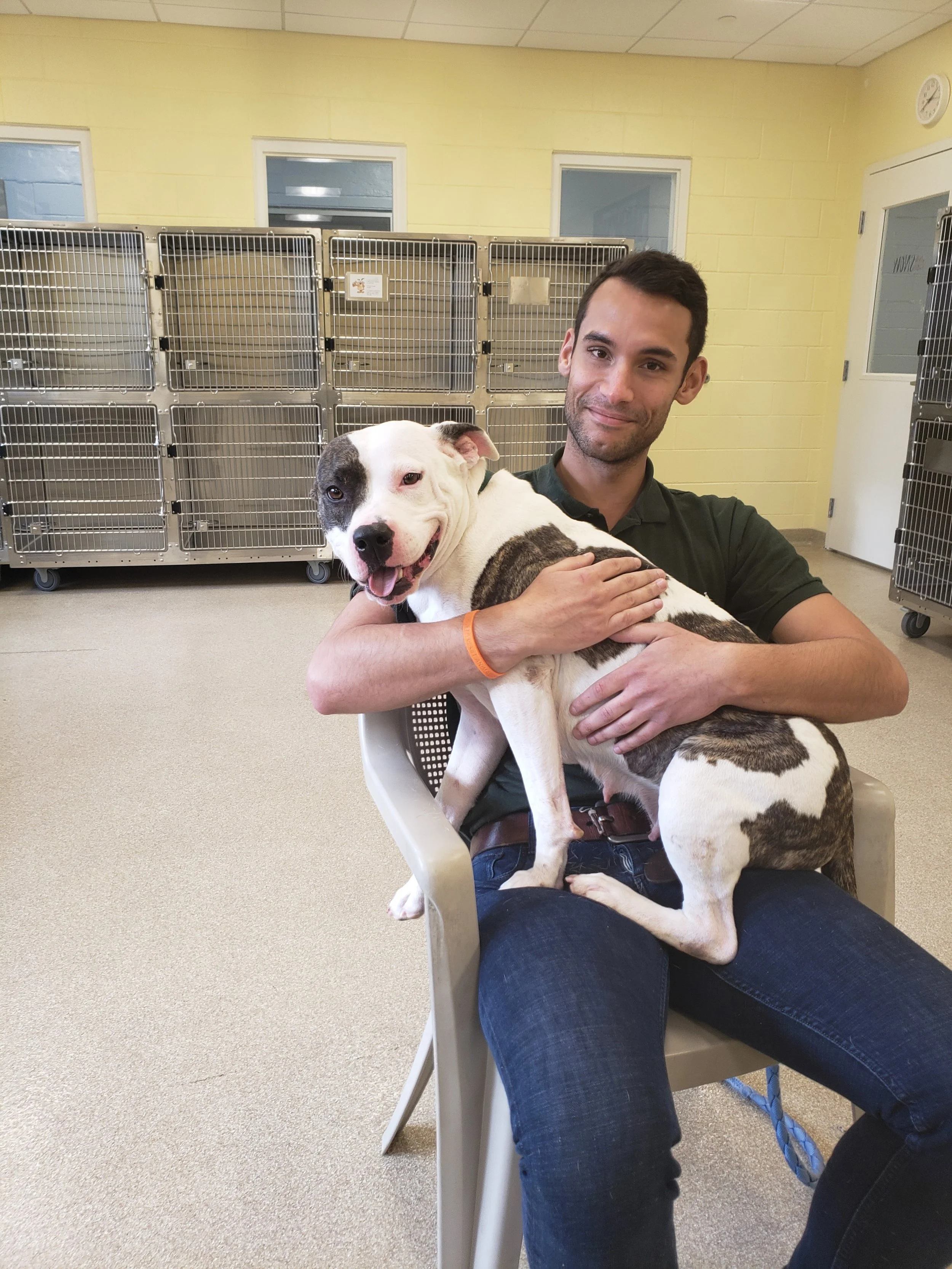 man holding dog in arms
