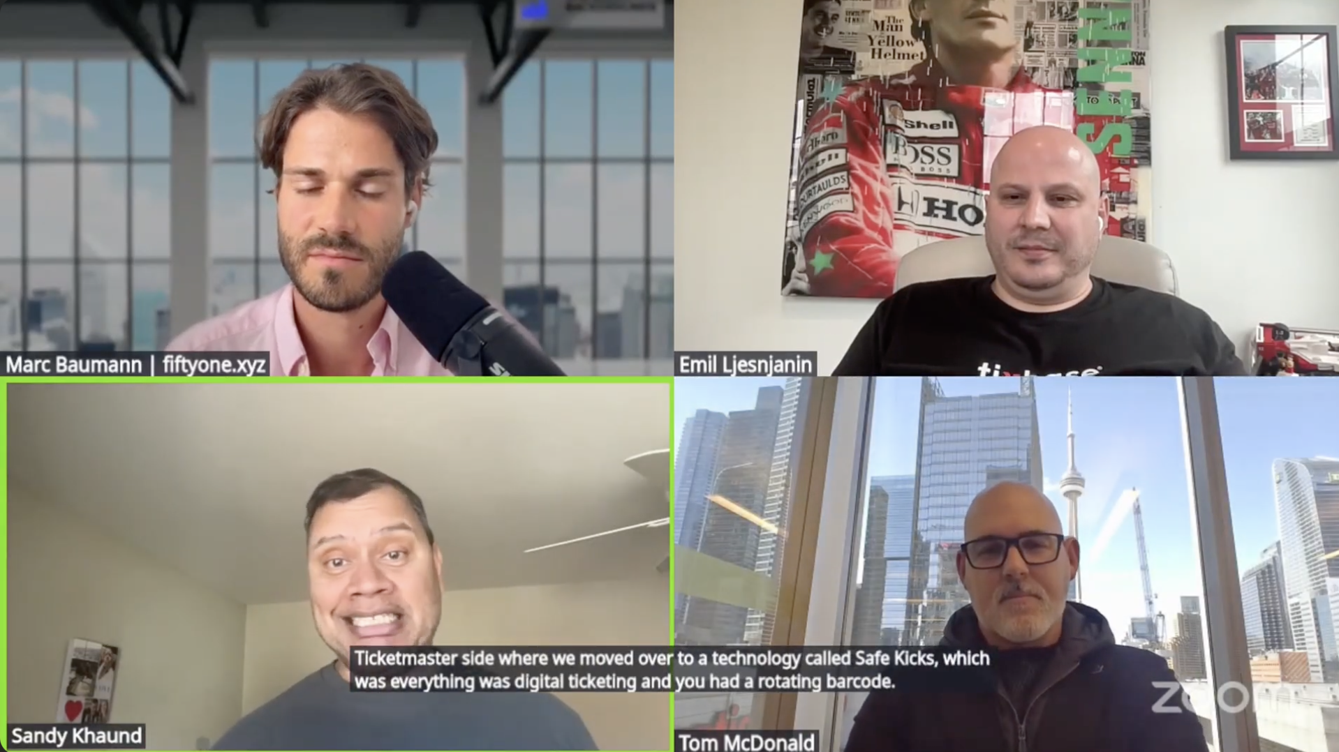 Virtual meeting with four men in different locations. Top left, man with brown hair and beard, speaking into a microphone with a cityscape background. Top right, bald man with earbuds, sitting in front of a collage poster with a city view. Bottom left, man with short hair, speaking with episode details in the subtitles, in a room with cream-colored walls. Bottom right, man with glasses and a bald head, sitting in a room with large windows and cityscape view.