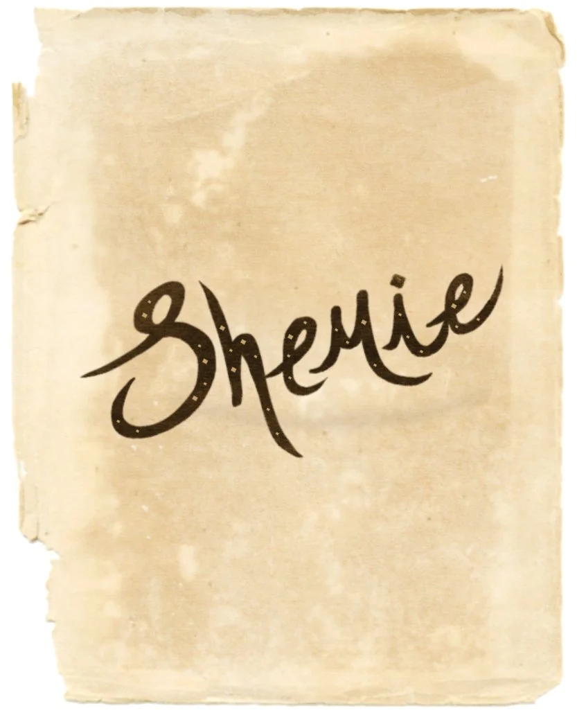 A handwritten note on aged, beige paper with the word "Shemie" written in black ink.