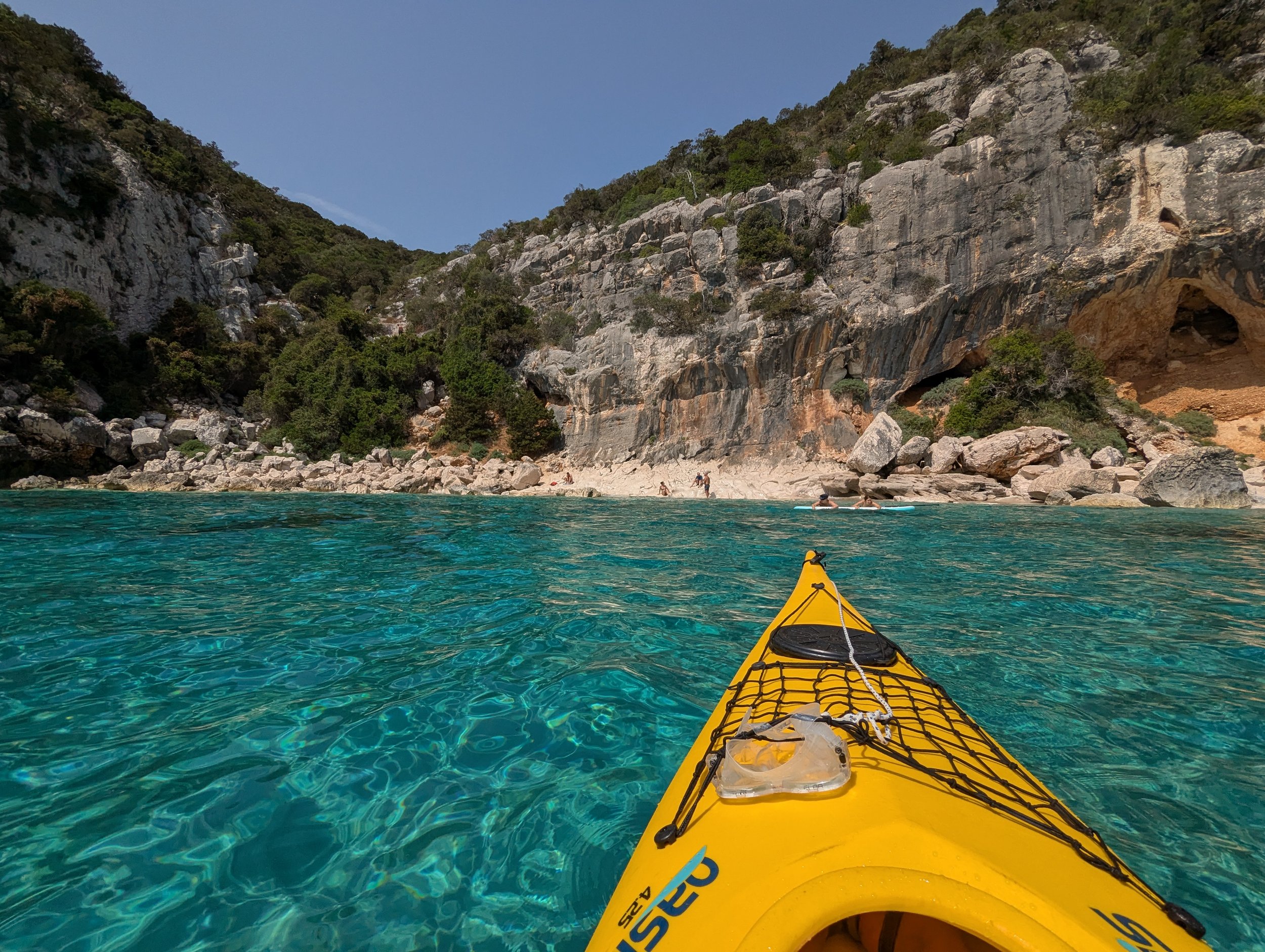 Unique Cala Luna Beach in Sardinia reached in Kayak from Cala Gonone in the shimmering turquoise sea.