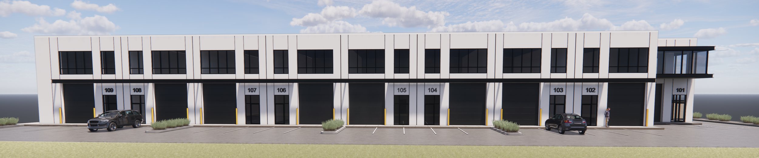 Modern commercial building with numbered units and parking spaces in front.