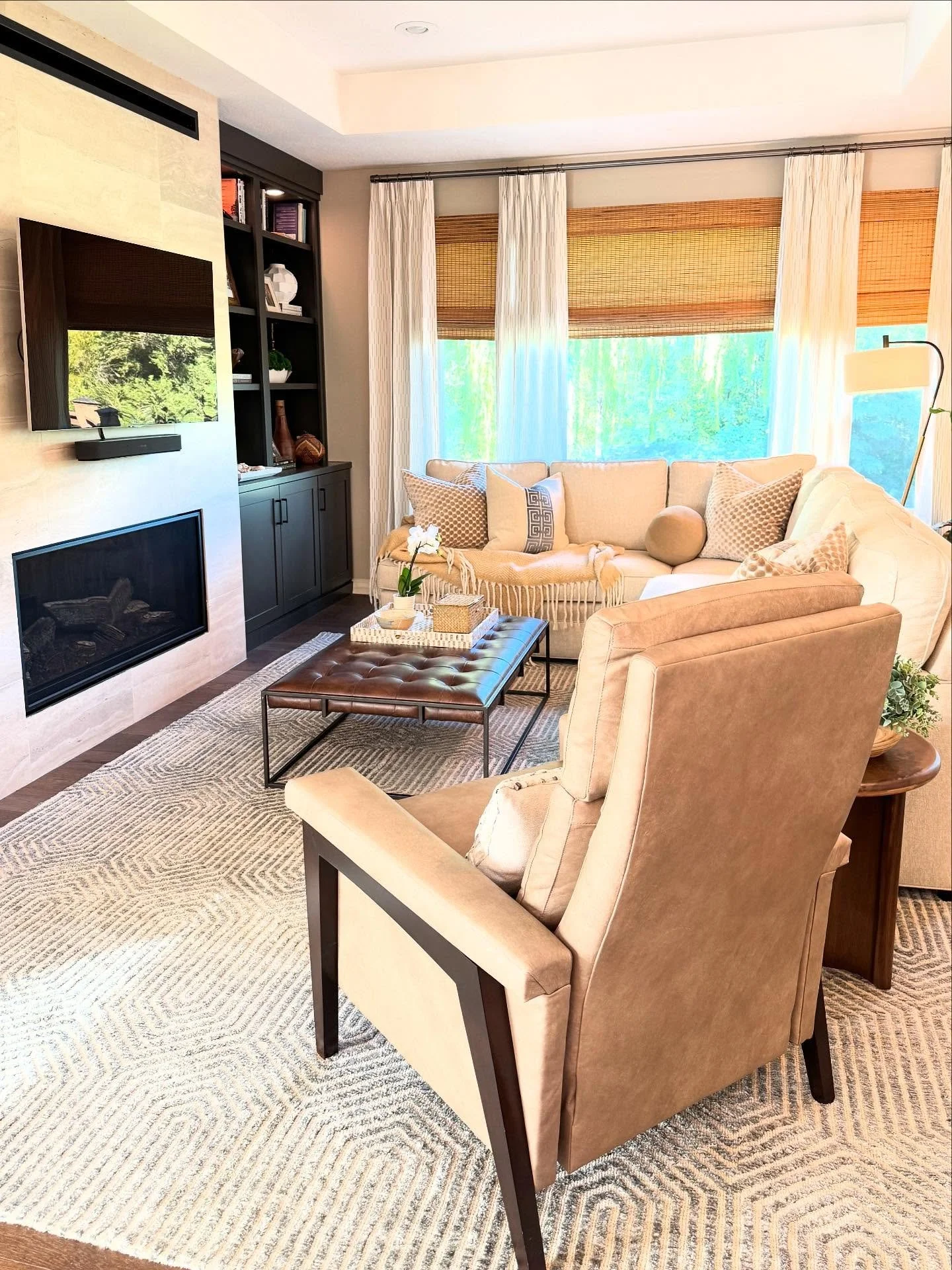 Swipe ➡️ to see the Before of this calm &amp; cozy family room. ✨ This glow-up features new furniture with a better layout, refreshed built-ins with a more modern fireplace, and collected treasures galore for a lived-in cozy vibe. 
.
.
.
DM for your 