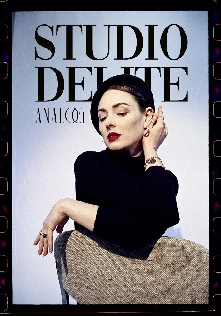 Missy Malone wearing a black hat and black top, sitting and touching her ear, with the text 'STUDIO DELITE ANALOG' in the background.