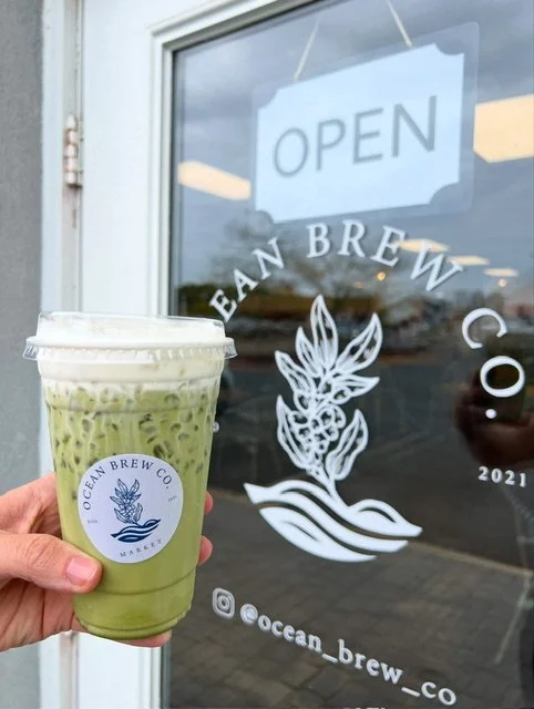 Iced matcha latte in front of Ocean Brew Co storefront in Ocean Township NJ