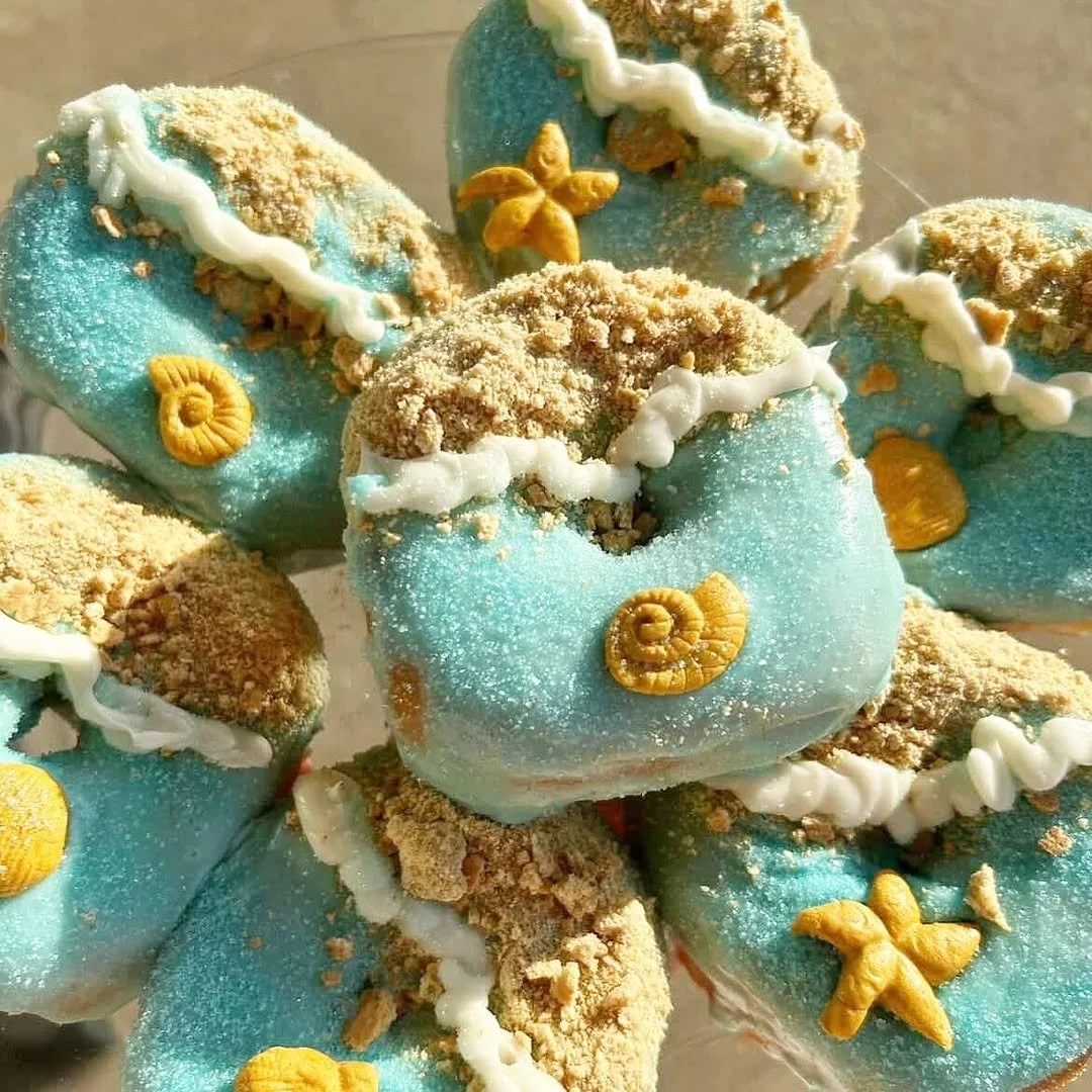 Blue frosted pastries topped with cereal at Ocean Brew Co