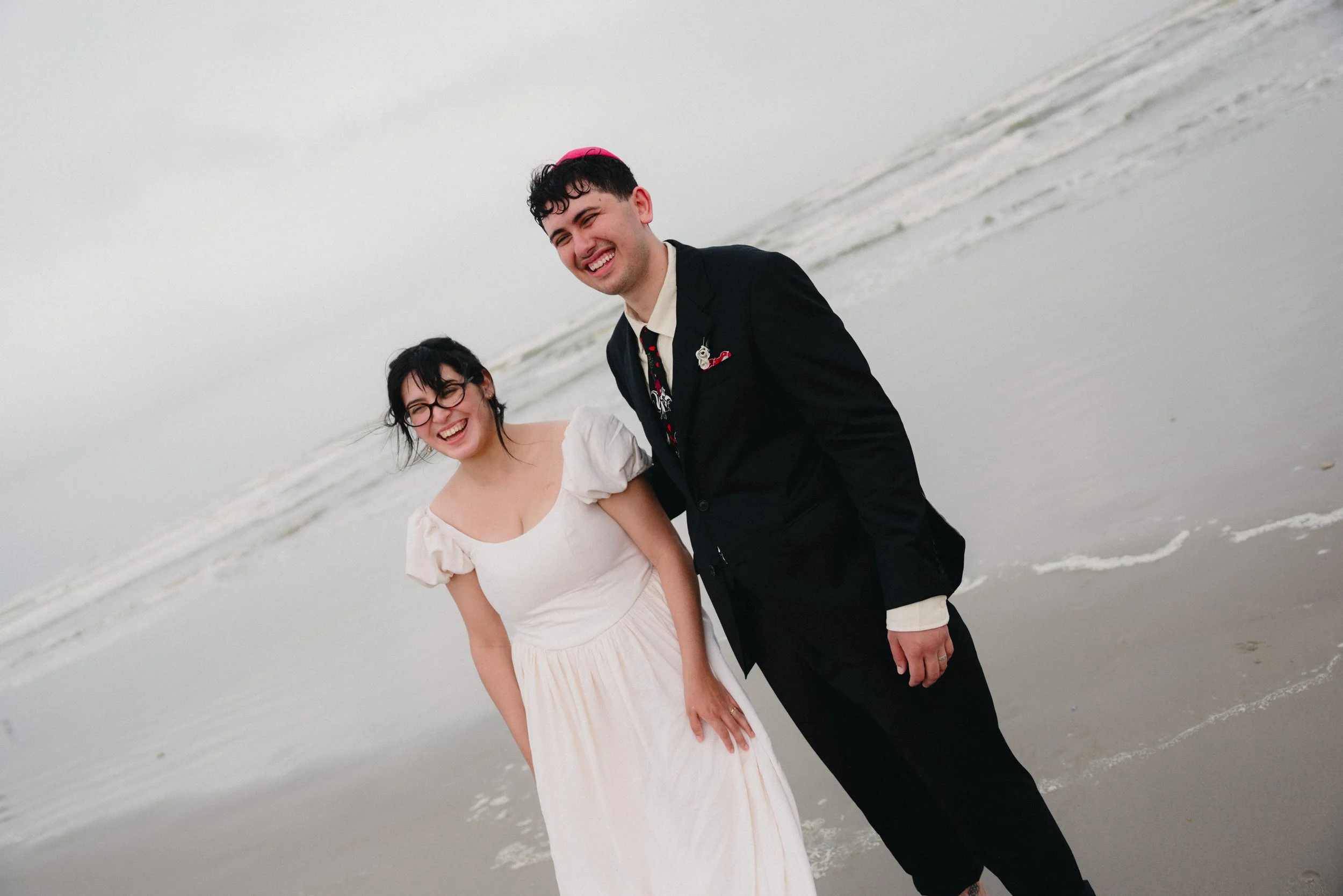 Bride and Groom on the beach in Texas for their wedding photographed by Colorado wedding photographers