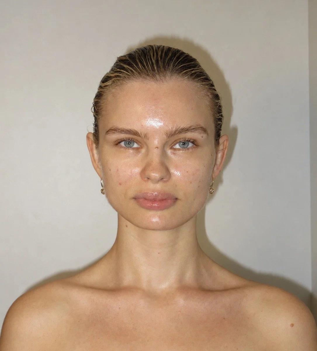 A model posing for close up after her Signature Glow Facial