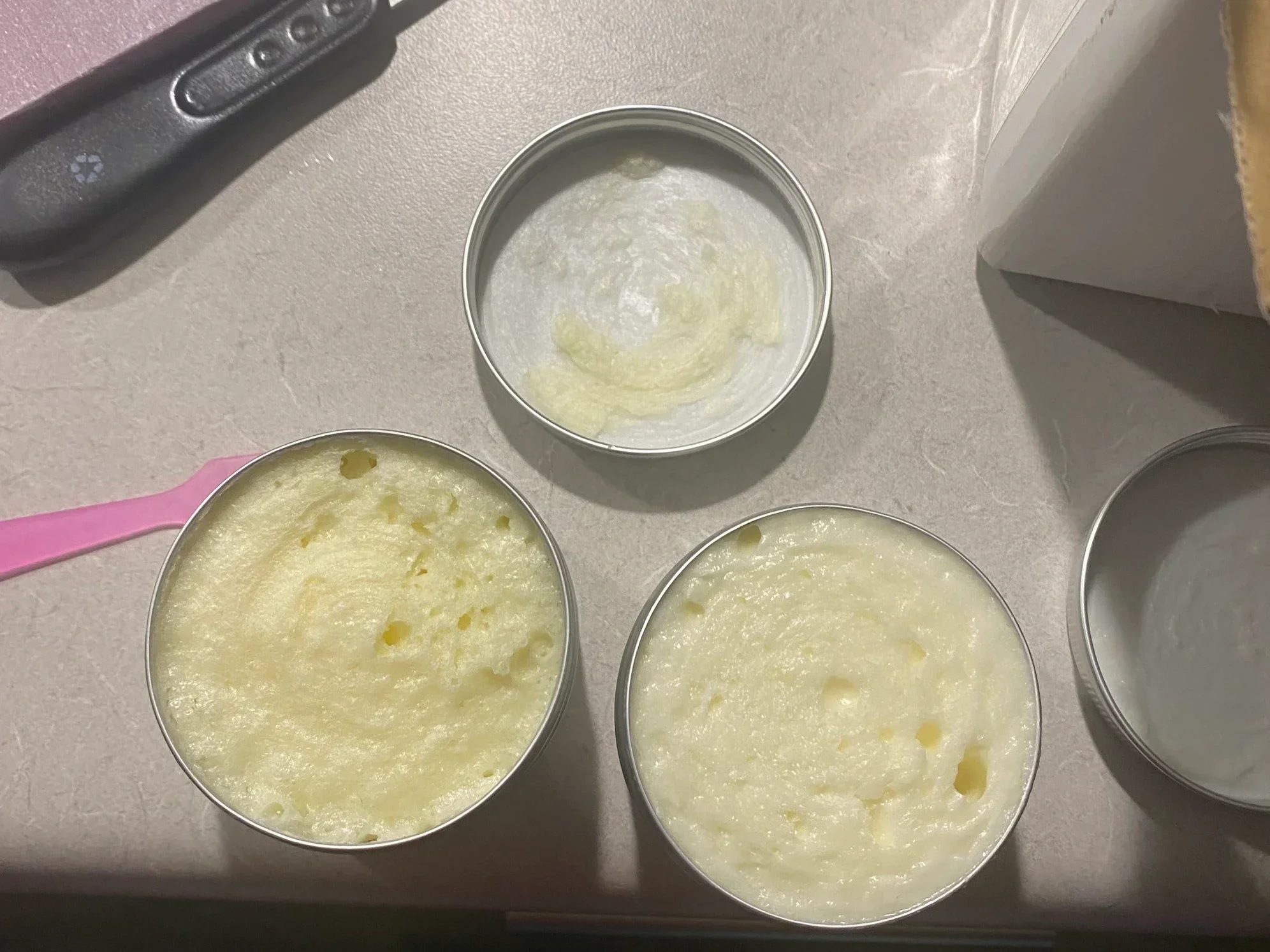 Customer review showing whipped body butter texture in open tins, rich moisturizing skincare by Teddy Bare Body.