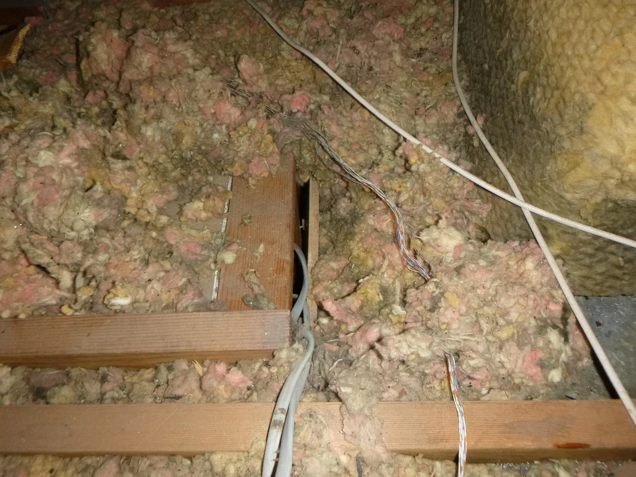 Large gap in the hallway wall's soffit cap, right next to the return duct.