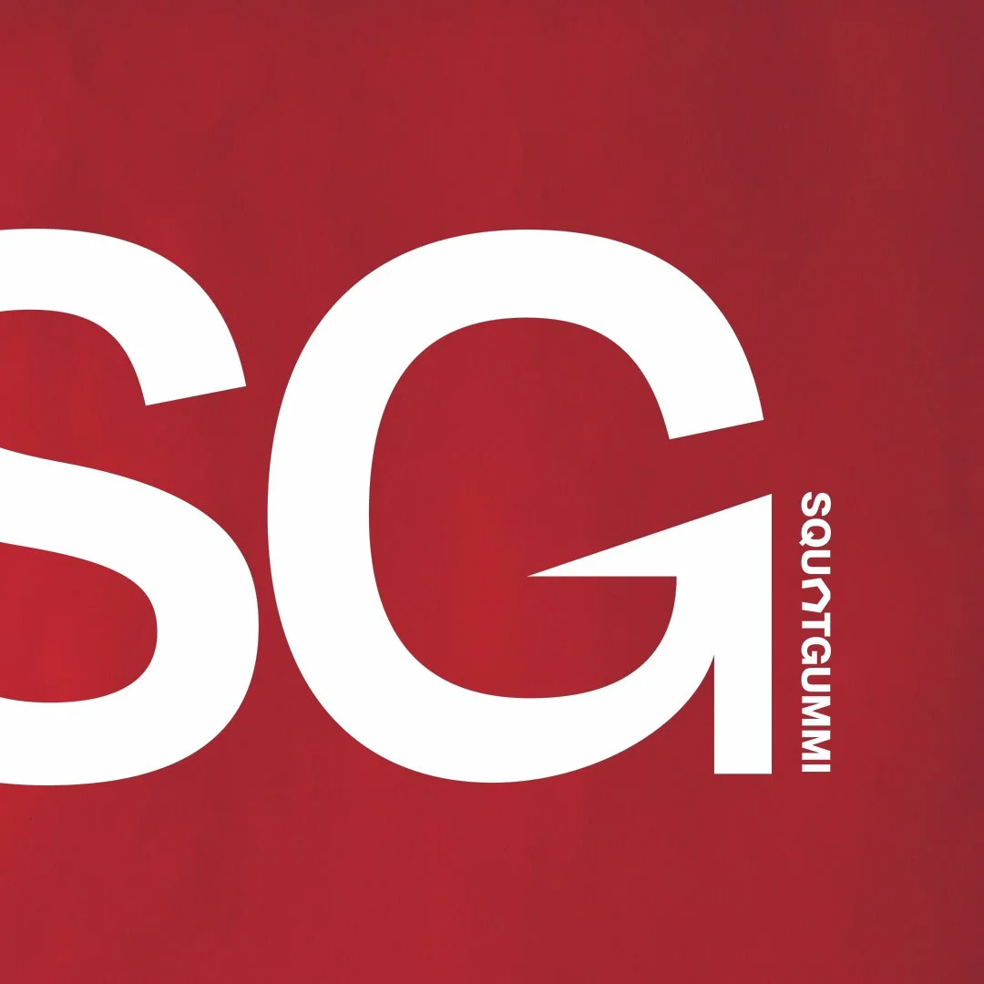 Close-up of a red background with large white text 'SG' and smaller white text 'SQUATGUMMI' aligned vertically.