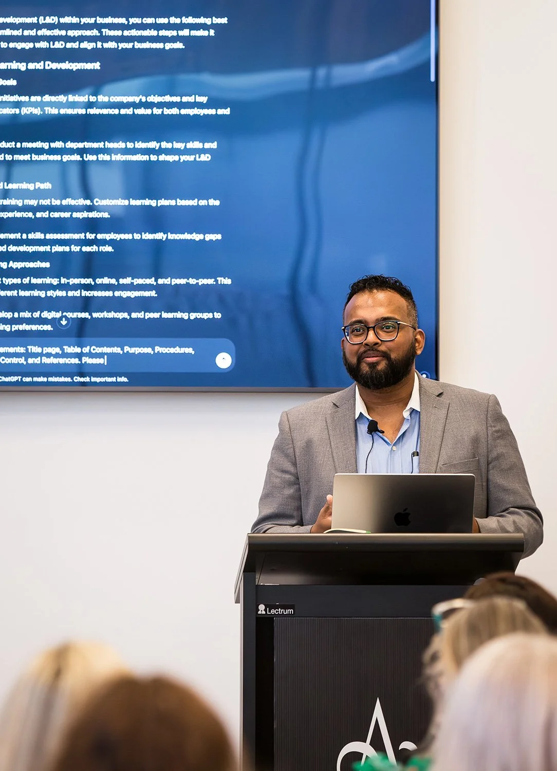 A keynote presenter engages the audience at Amora Hotel Brisbane