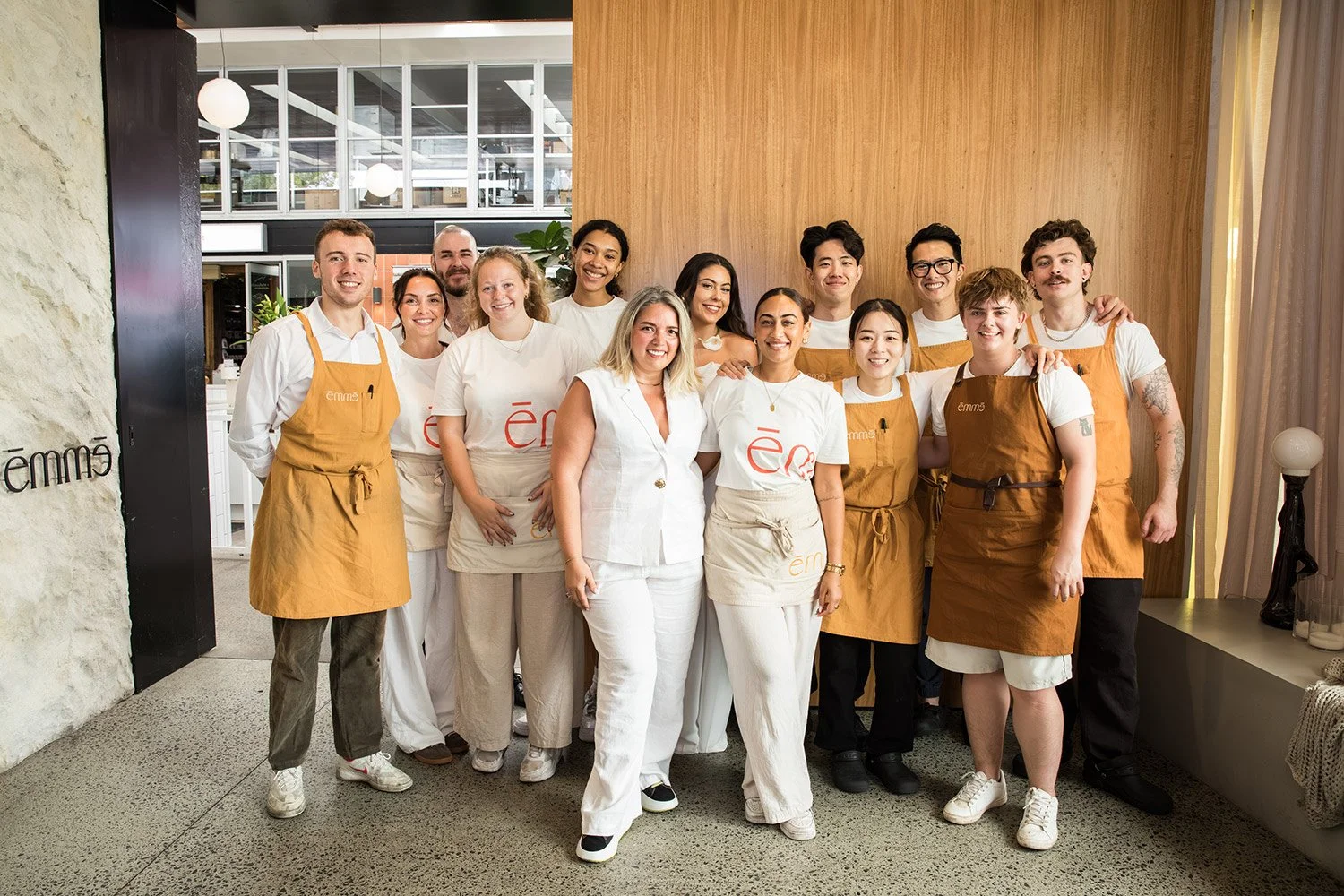 Group photo of the emme James Street staff before a lunch event