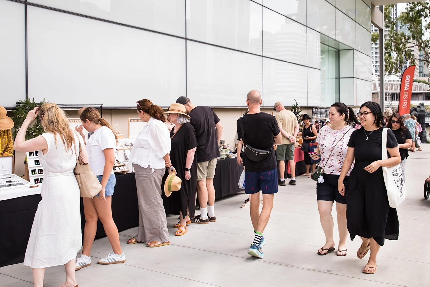 Relaxed crowd exploring public design market