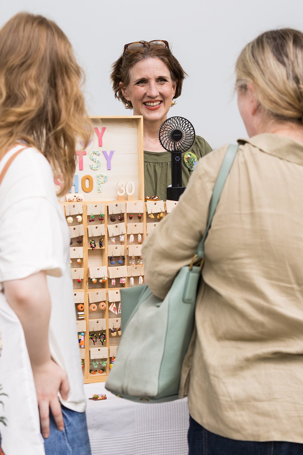 Guests engaging with market event stallholder