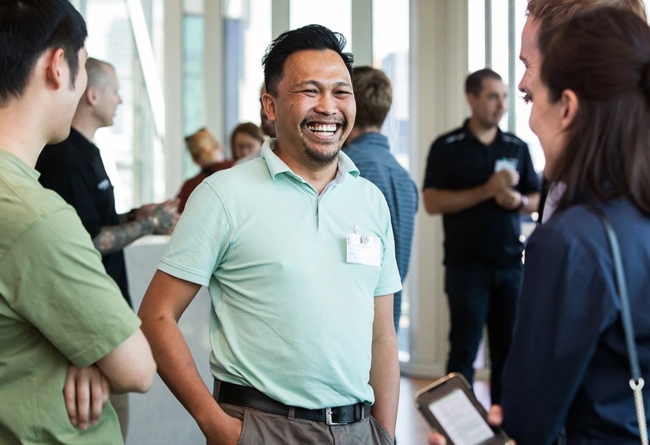 Networking and conversation during a coffee break at Brisbane conference