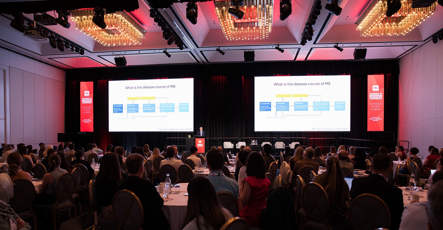 Wide view of full room during a conference presentation in Brisbane