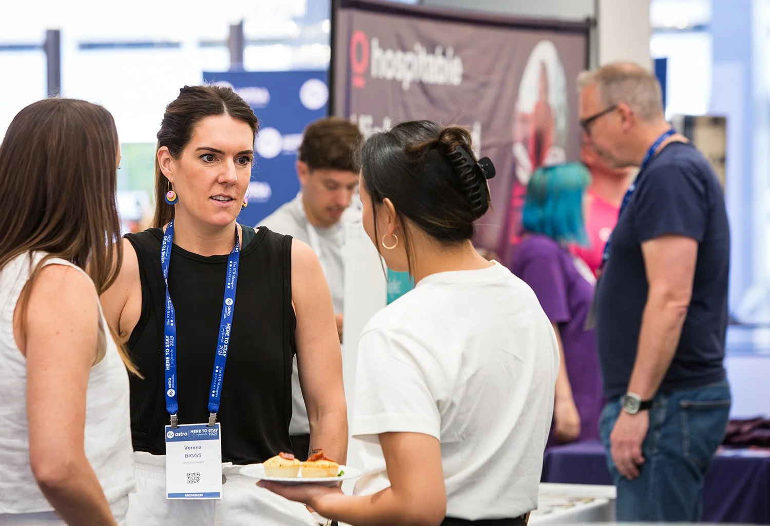 Summit delegates networking during a coffee break at Sofitel Brisbane Central