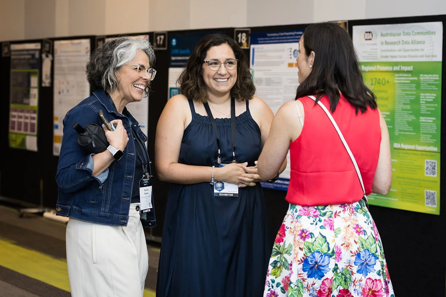 Conference attendees connecting during a poster session at BCEC
