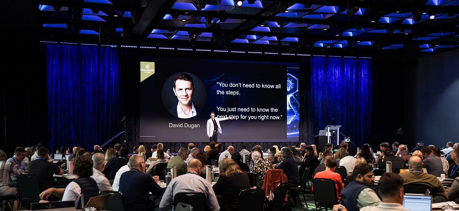 Wide view from back of room as a presenter engages conference attendees at The Star Brisbane