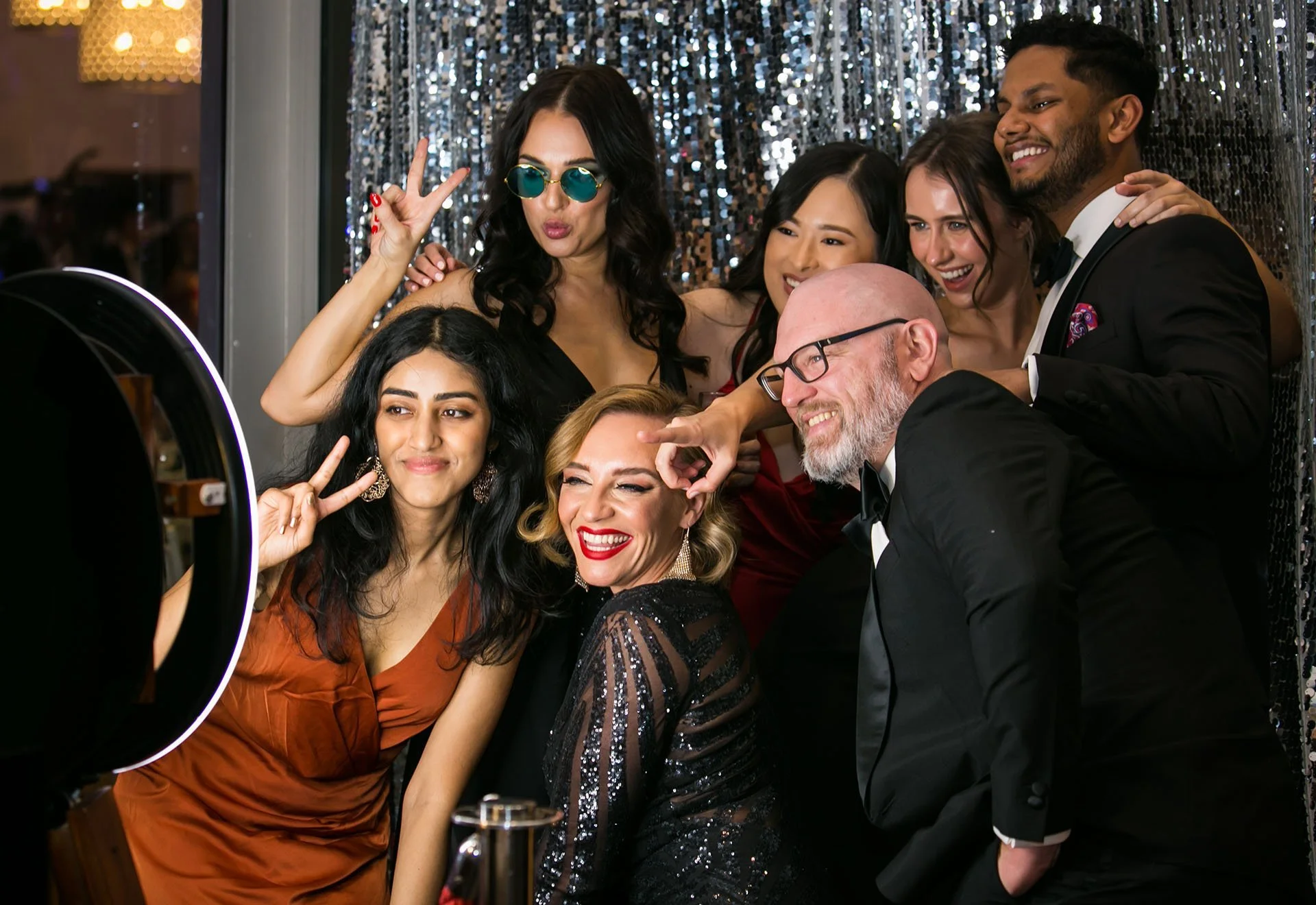 Attendees enjoying photo booth at Brisbane cocktail event
