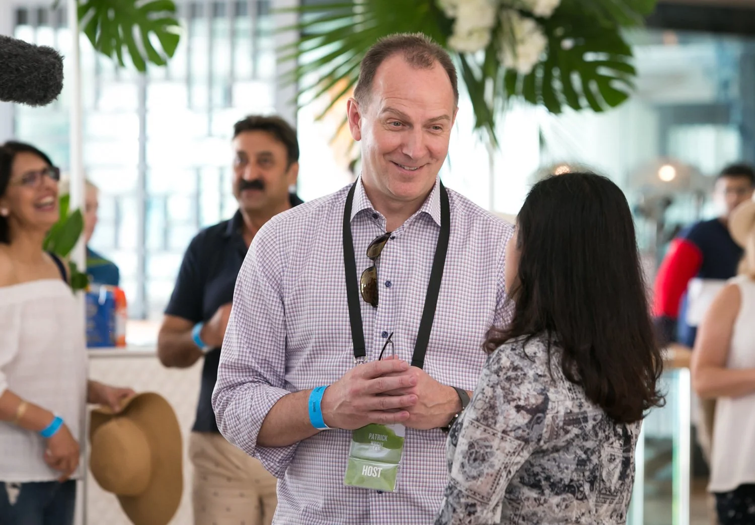 Conference hosts and delegates connect during a coffee break at the Gold Coast