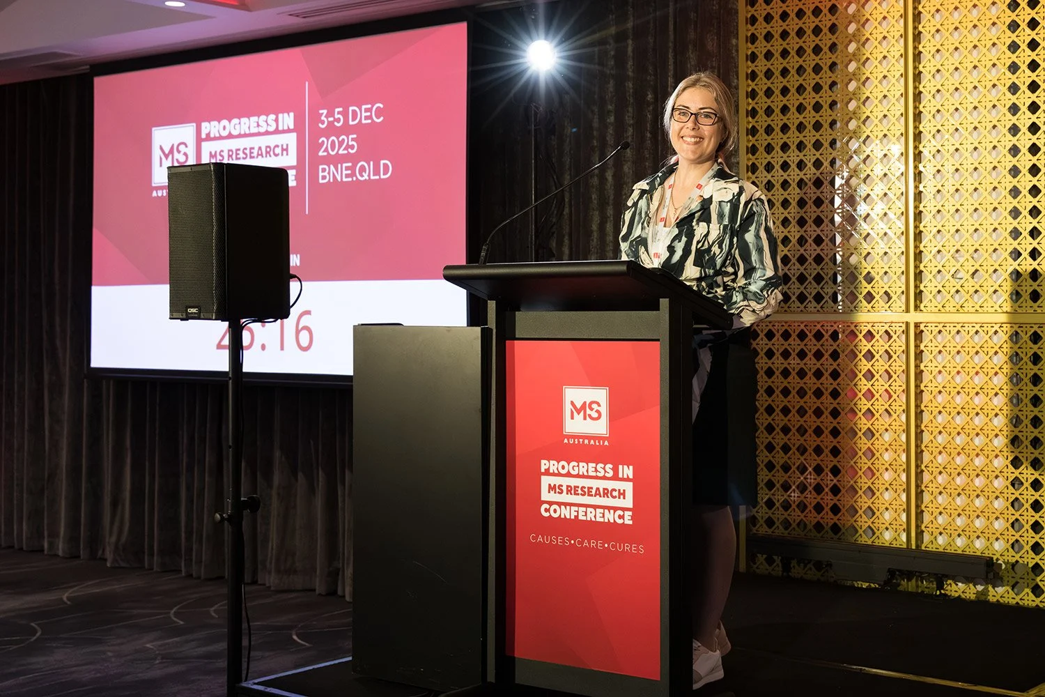 Keynote speaker presents at conference in the Lyon Room, Sofitel Brisbane Central