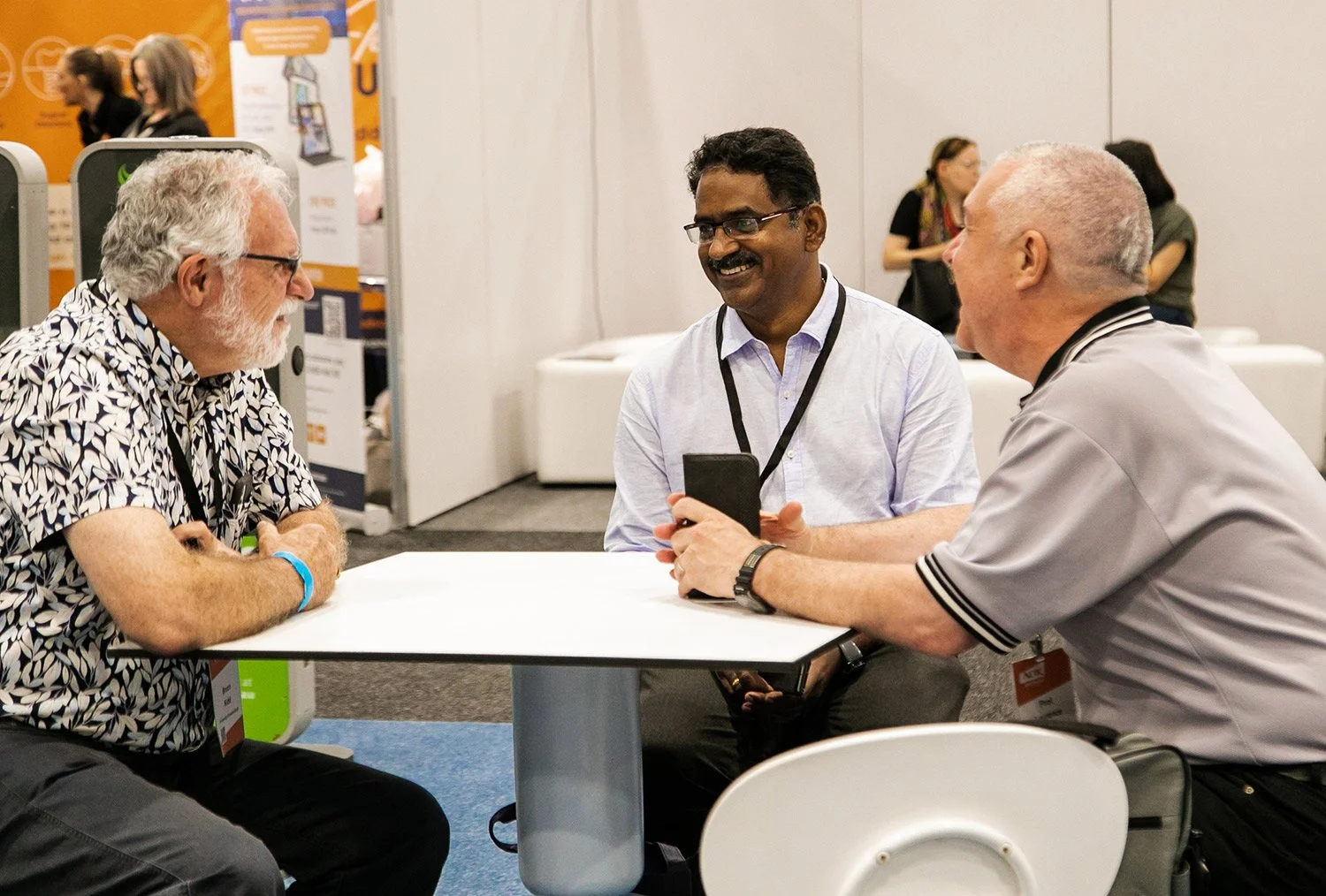 Seated expo attendees enjoying a conversation at BCEC