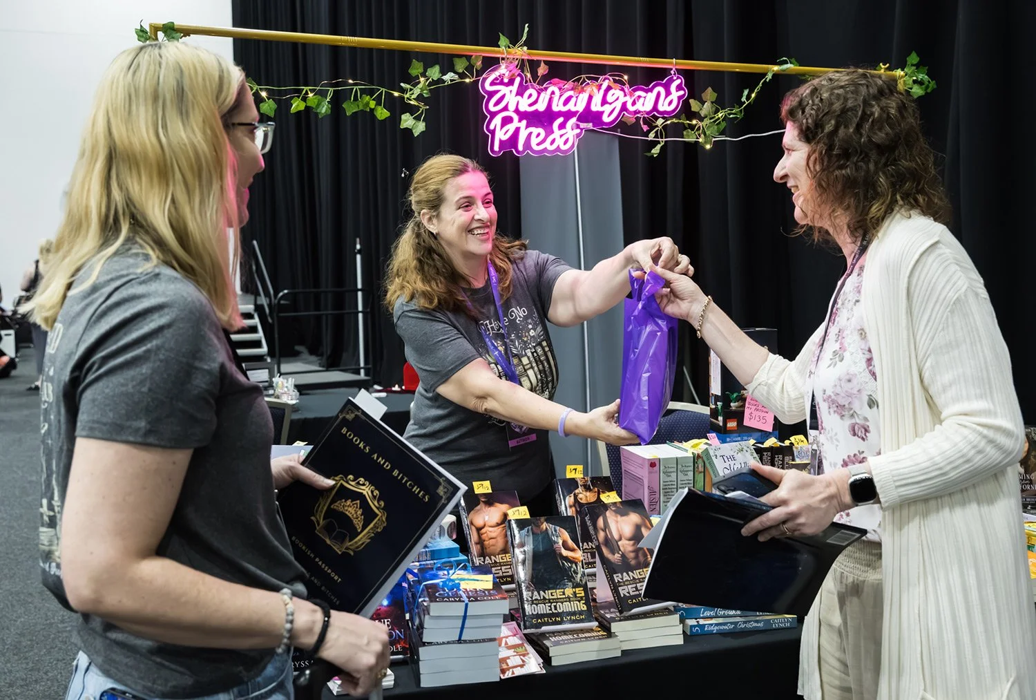 Attendee purchasing product at Brisbane book signing expo