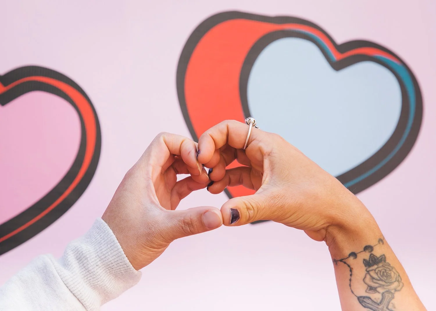 Love heart hands at public brand activation
