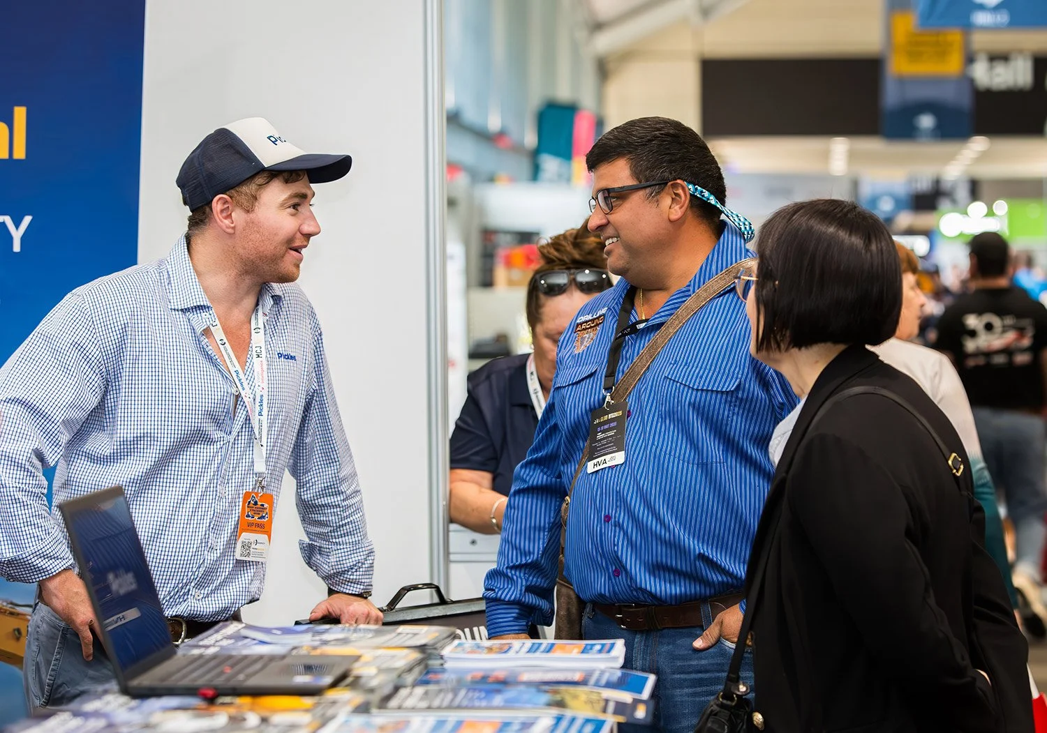 Conversation between exhibitor and attendees at BCEC in Brisbane