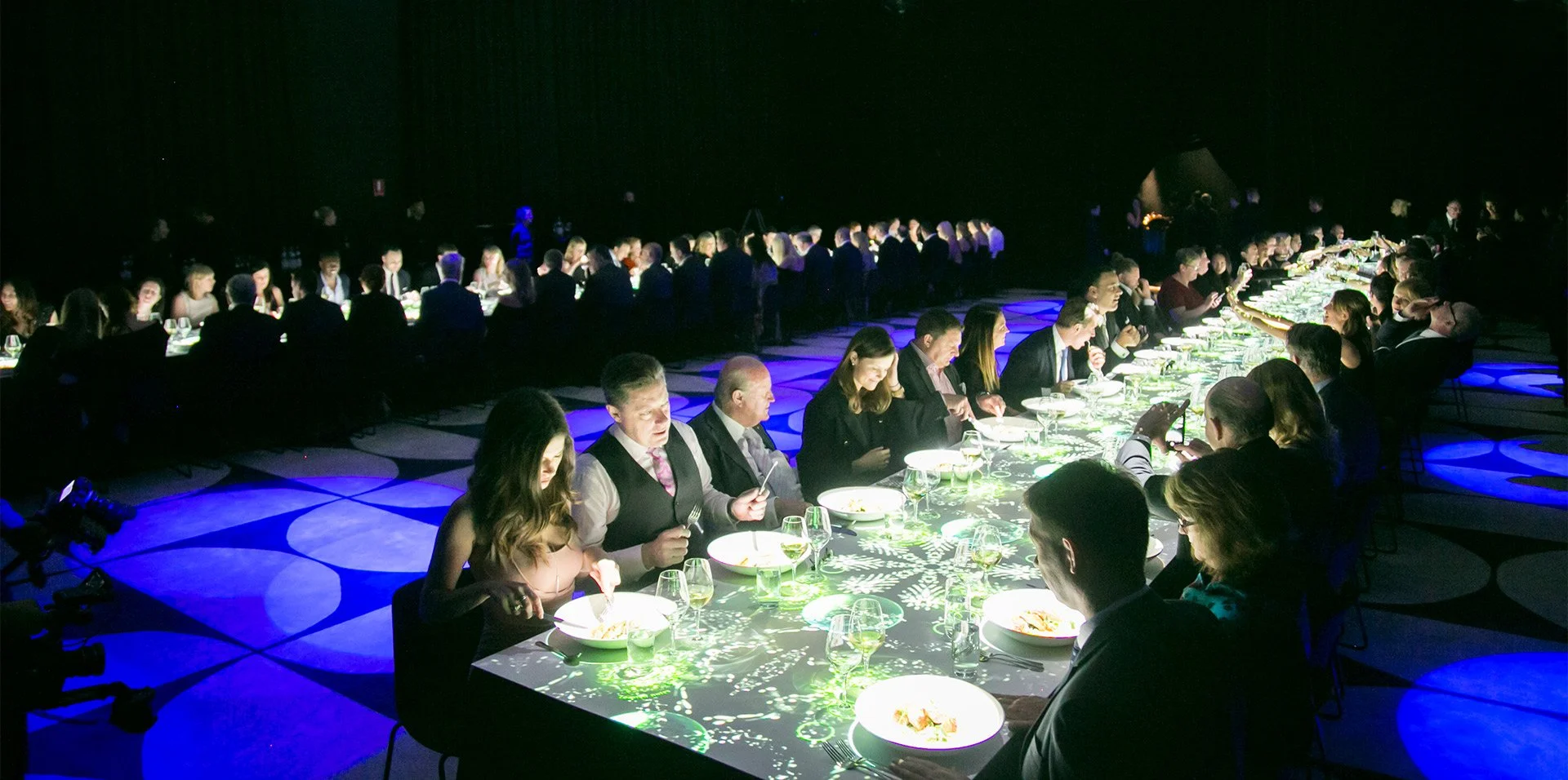 Brisbane gala dinner guests dining in atmospheric light