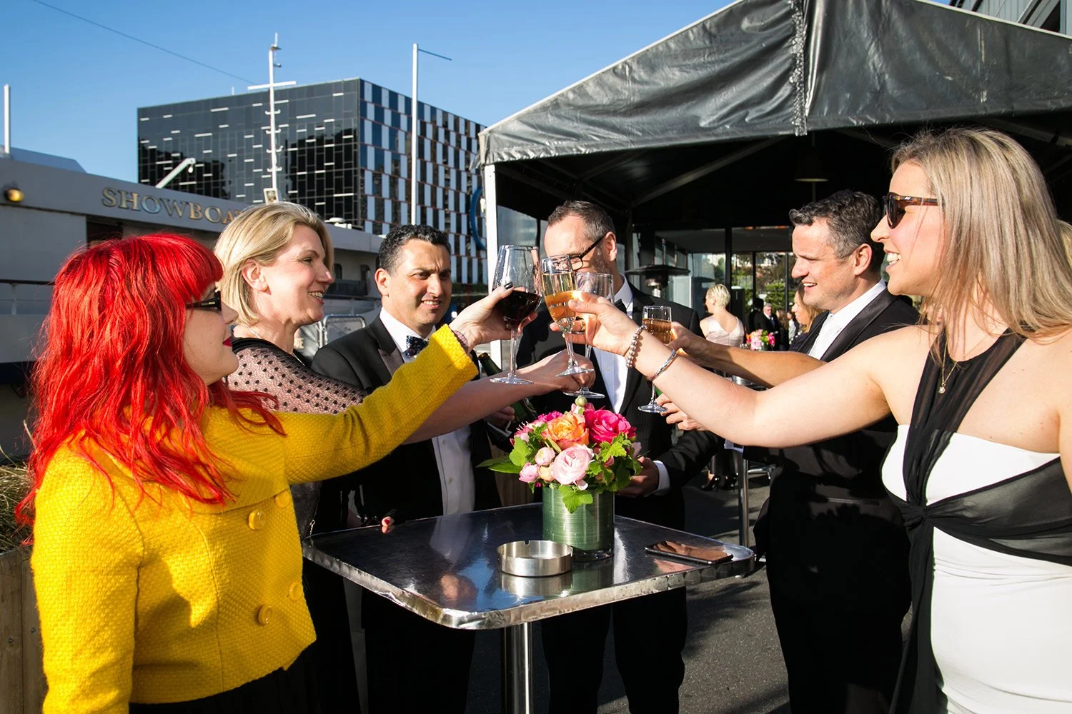 Guests clinking glasses at drinks before a gala event