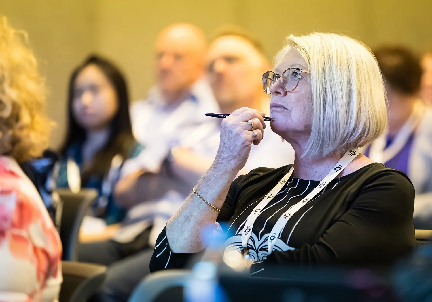 Audience listens intently during a plenary session at Brisbane Sofitel Central