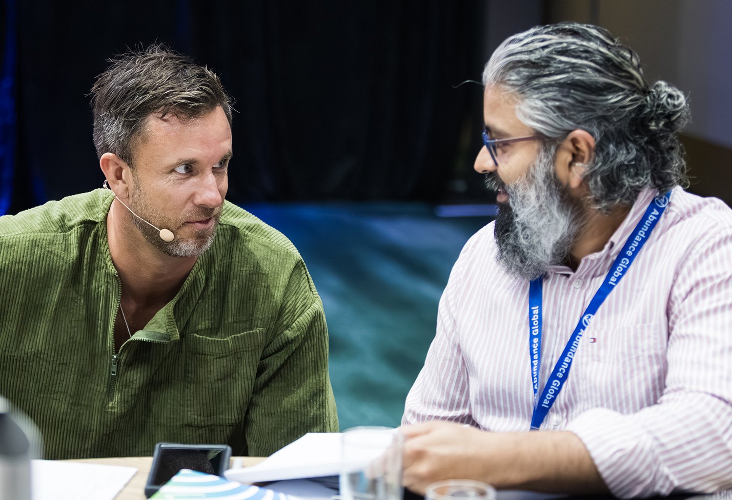Keynote speaker interacting with audience member