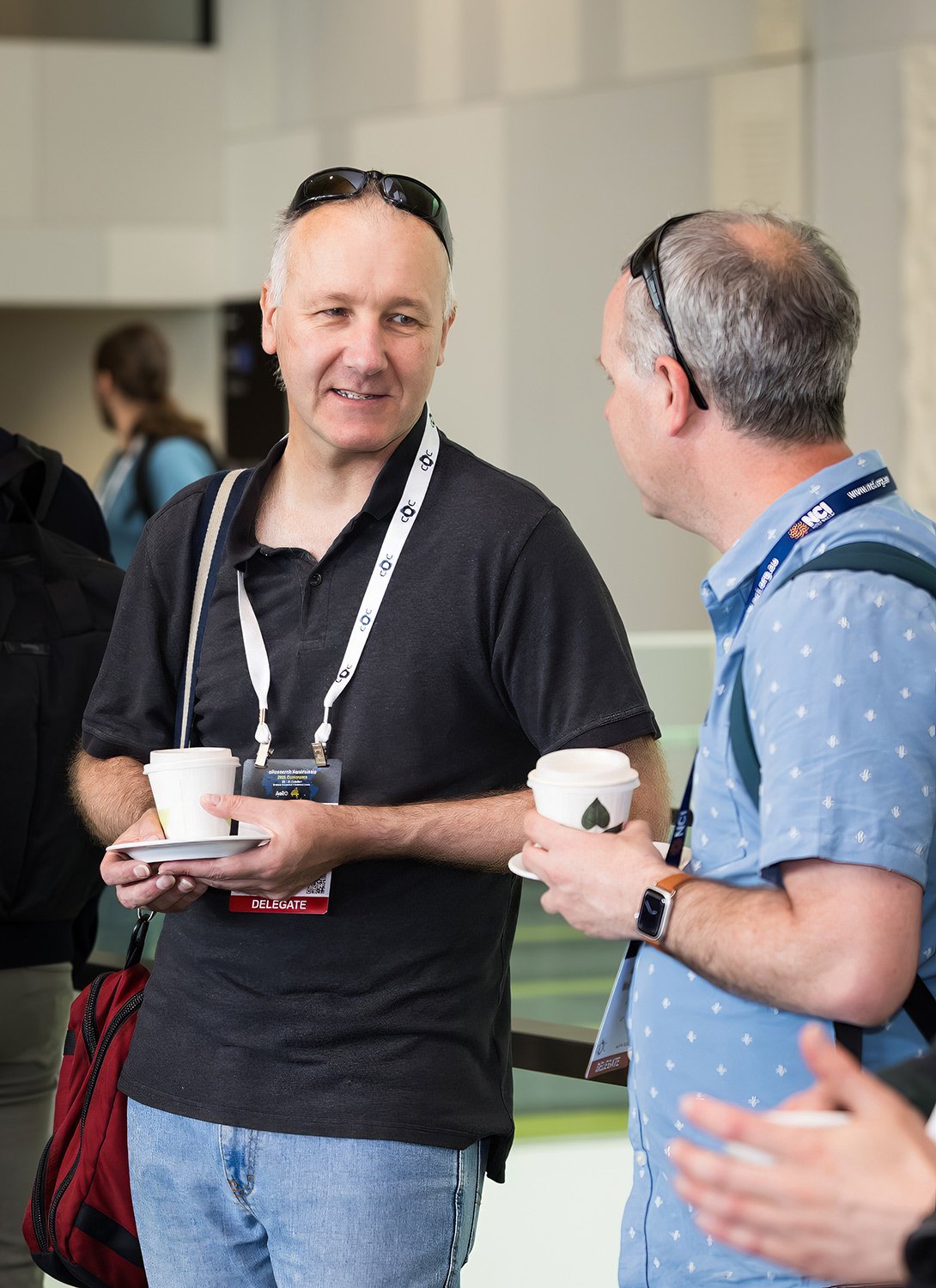 Networking and conversation during a coffee break at a Brisbane Sofitel conference