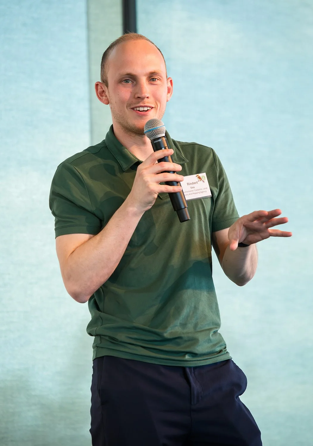 Presenter delivering an engaging keynote at a QUT conference